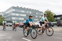 Two men in sportswear on bicycles