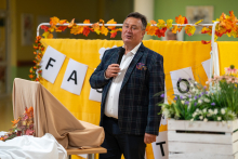 The Director of Nowowiejski Hospital speaking into a microphone